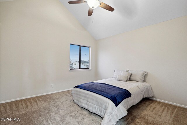 bedroom featuring lofted ceiling, carpet, baseboards, and ceiling fan