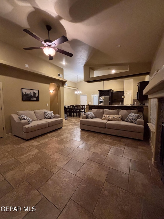 14215 Rattler Point Dr, El Paso, TX 79938 - living area with a ceiling fan, stone tile floors, and a chandelier