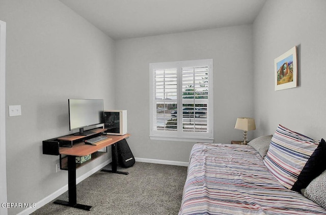 carpeted bedroom with baseboards