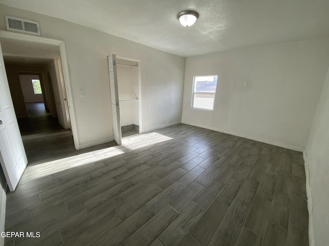 2805 Grant Ave, El Paso, TX 79930 - unfurnished bedroom featuring wood finish floors, baseboards, and a closet