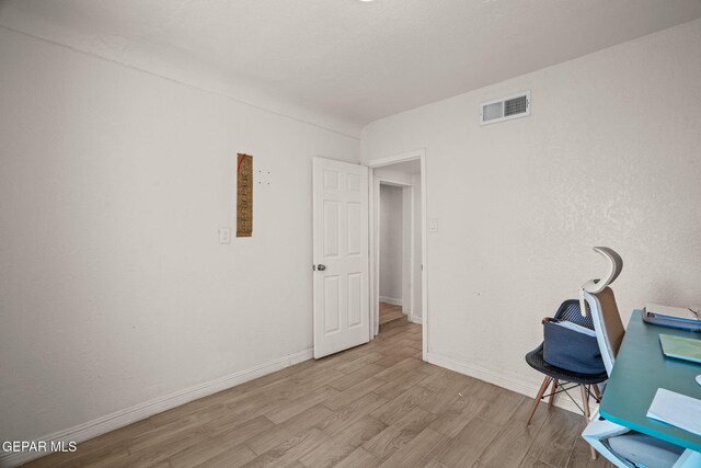 2805 Grant Ave, El Paso, TX 79930 - unfurnished office featuring wood finished floors and baseboards