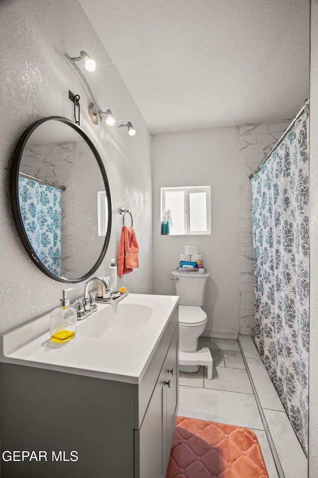2805 Grant Ave, El Paso, TX 79930 - full bathroom with vanity, a textured ceiling, toilet, and a shower with curtain