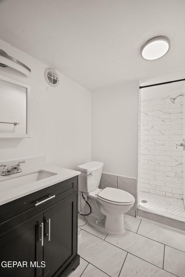 2805 Grant Ave, El Paso, TX 79930 - bathroom featuring vanity, a shower stall, and toilet