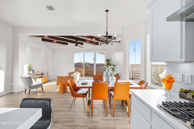 3829 Aspire Pl, El Paso, TX 79938 - dining space with a chandelier, beamed ceiling, and light wood finished floors