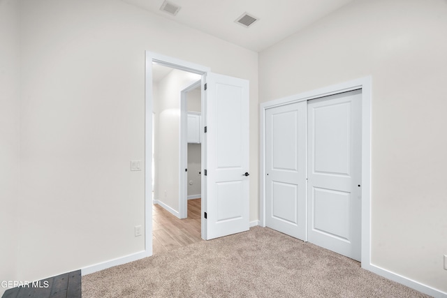 3829 Aspire Pl, El Paso, TX 79938 - unfurnished bedroom featuring light carpet, a closet, and baseboards