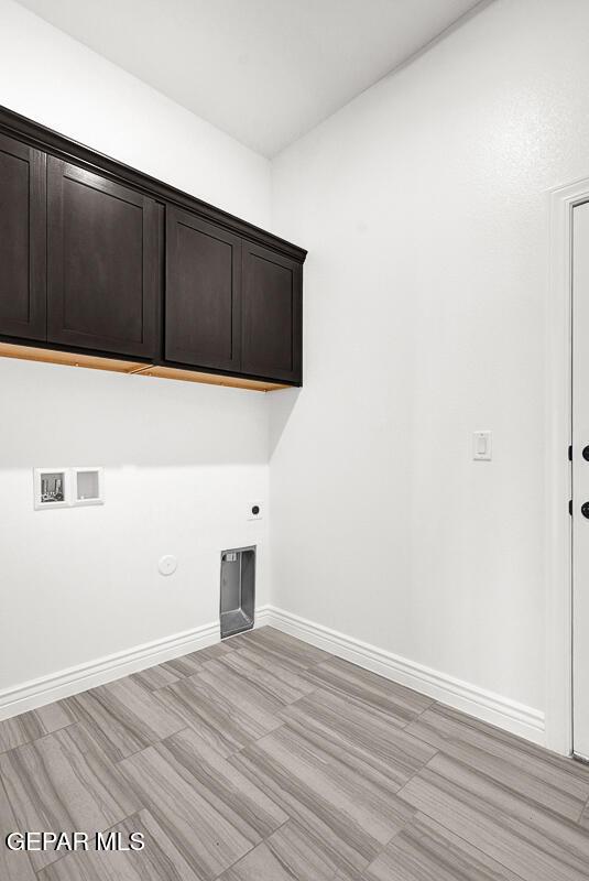 3825 Aspire Pl, El Paso, TX 79938 - laundry room with cabinet space, hookup for a washing machine, baseboards, hookup for an electric dryer, and hookup for a gas dryer