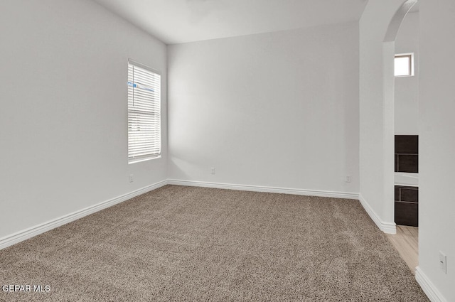 3825 Aspire Pl, El Paso, TX 79938 - empty room featuring arched walkways, carpet, and baseboards