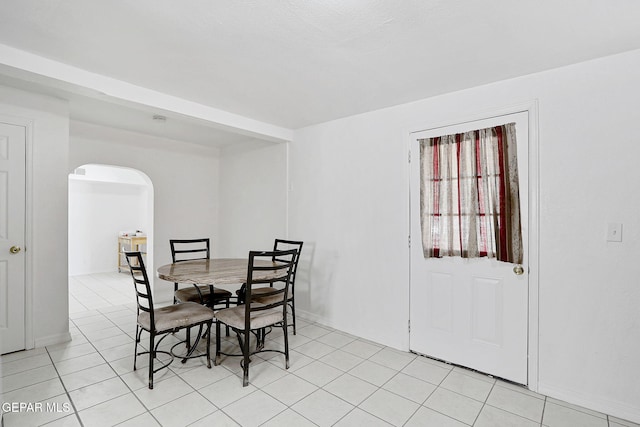 7701 Hermosillo Dr, El Paso, TX 79915 - dining space with arched walkways and light tile patterned flooring