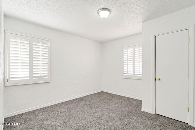 7701 Hermosillo Dr, El Paso, TX 79915 - carpeted spare room featuring a textured ceiling and baseboards