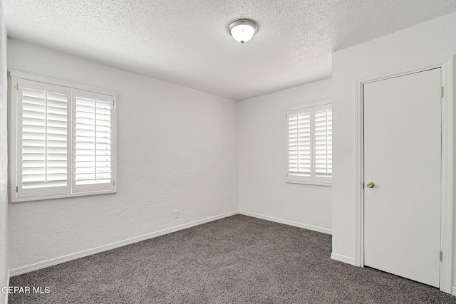 7701 Hermosillo Dr, El Paso, TX 79915 - spare room featuring carpet flooring, a textured ceiling, baseboards, and a textured wall