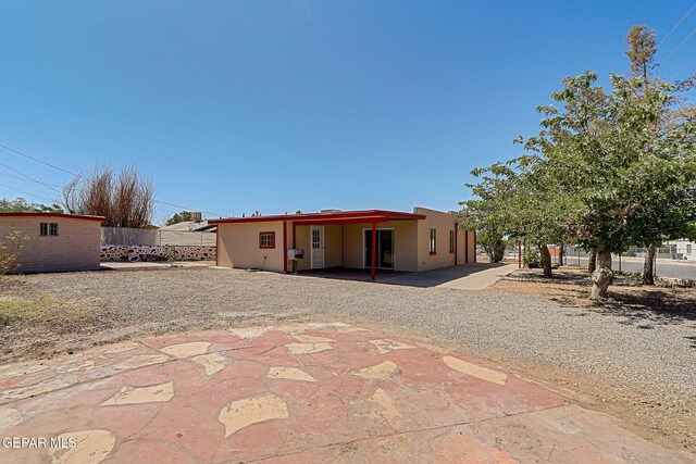 7701 Hermosillo Dr, El Paso, TX 79915 - back of property with a patio area and driveway