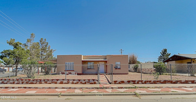 7701 Hermosillo Dr, El Paso, TX 79915 - view of front of property with stucco siding, a fenced front yard, and a gate
