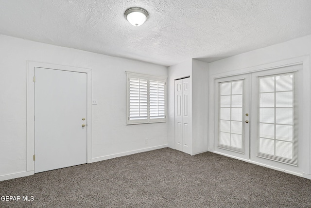 7701 Hermosillo Dr, El Paso, TX 79915 - unfurnished bedroom featuring carpet, a textured ceiling, and baseboards