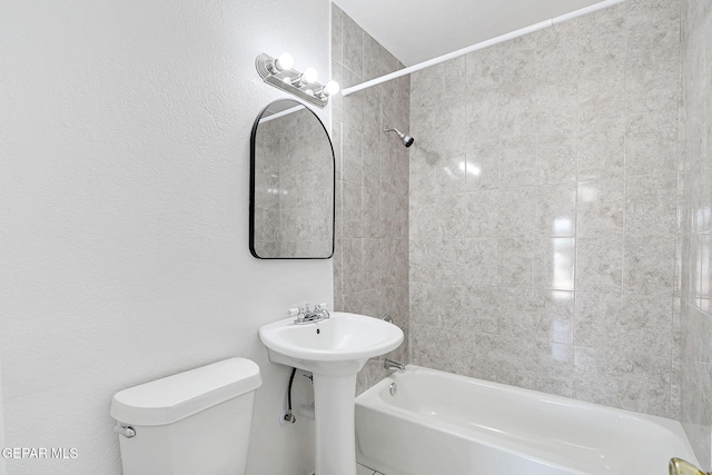 7701 Hermosillo Dr, El Paso, TX 79915 - bathroom featuring toilet, shower / washtub combination, and a sink