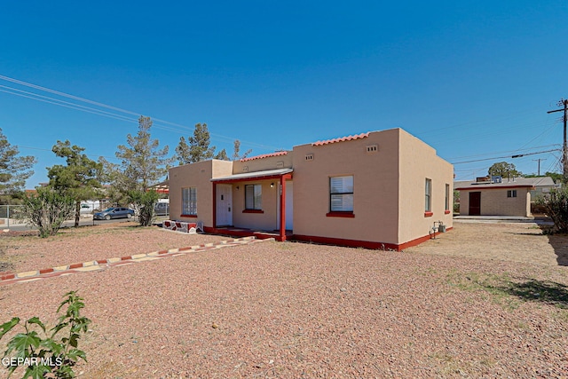 7701 Hermosillo Dr, El Paso, TX 79915 - back of house with stucco siding and a tiled roof