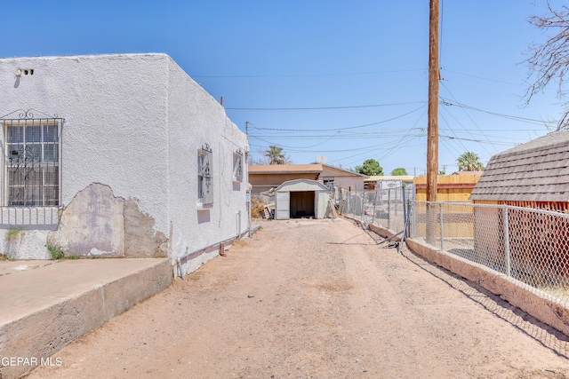 159 Silvas Way, El Paso, TX 79907 - view of home's exterior with a shed and stucco siding