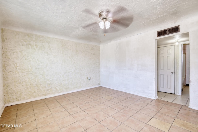 159 Silvas Way, El Paso, TX 79907 - unfurnished room featuring ceiling fan, light tile patterned floors, and a textured ceiling