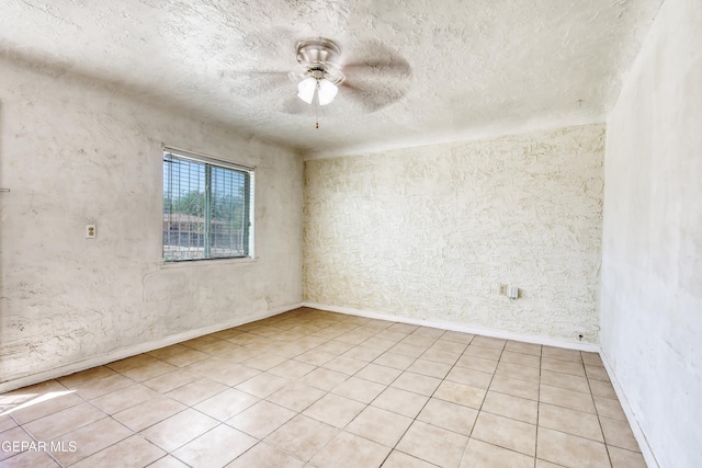 159 Silvas Way, El Paso, TX 79907 - spare room with a textured ceiling, ceiling fan, and light tile patterned floors