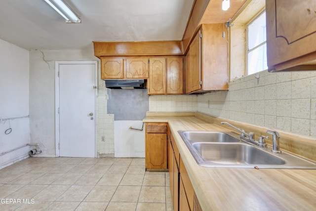 159 Silvas Way, El Paso, TX 79907 - kitchen with light tile patterned flooring, brown cabinetry, decorative backsplash, and wooden counters