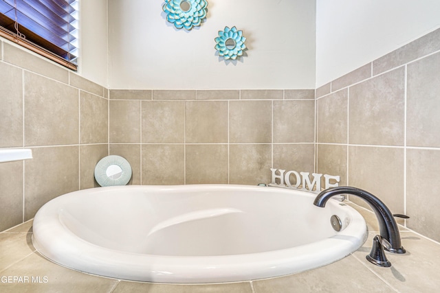 13729 Blackburn Ave, El Paso, TX 79928 - bathroom with tile walls and a garden tub