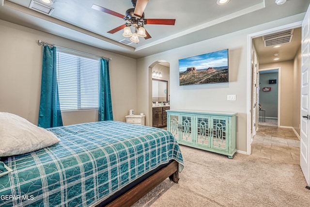 13729 Blackburn Ave, El Paso, TX 79928 - bedroom featuring arched walkways, carpet floors, a tray ceiling, recessed lighting, and baseboards