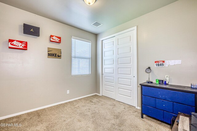 13729 Blackburn Ave, El Paso, TX 79928 - carpeted bedroom with baseboards and a closet