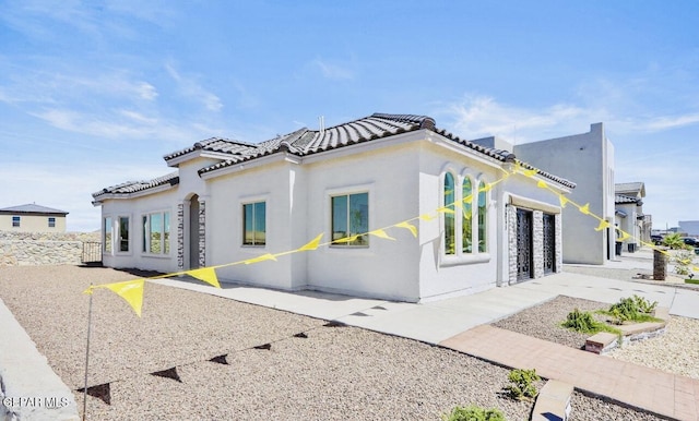 556 Cedarwood Ave, El Paso, TX 79928 - view of home's exterior with stucco siding and a tiled roof