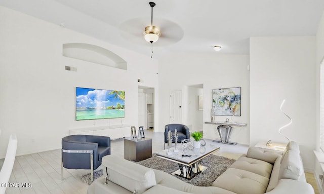 556 Cedarwood Ave, El Paso, TX 79928 - living area featuring ceiling fan, baseboards, and a high ceiling