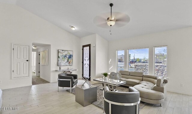 556 Cedarwood Ave, El Paso, TX 79928 - living room with ceiling fan, light wood finished floors, lofted ceiling, and baseboards