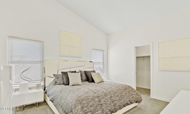 556 Cedarwood Ave, El Paso, TX 79928 - bedroom with light colored carpet, a spacious closet, high vaulted ceiling, and baseboards