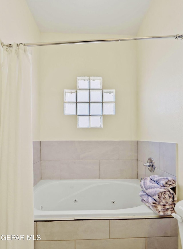 556 Cedarwood Ave, El Paso, TX 79928 - bathroom with a jetted tub and toilet