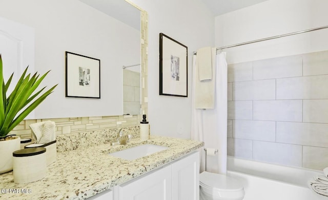 556 Cedarwood Ave, El Paso, TX 79928 - full bathroom featuring toilet, tasteful backsplash, shower / bath combo, and vanity
