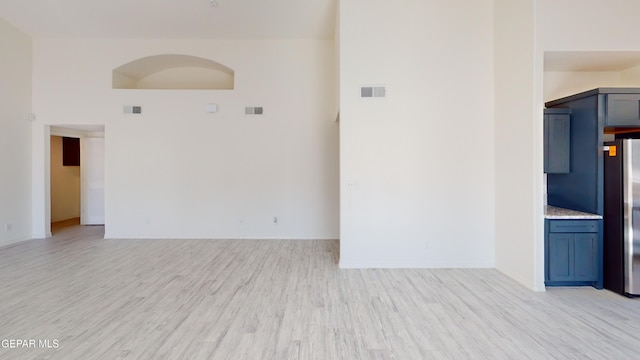 556 Cedarwood Ave, El Paso, TX 79928 - spare room with light wood-type flooring and baseboards