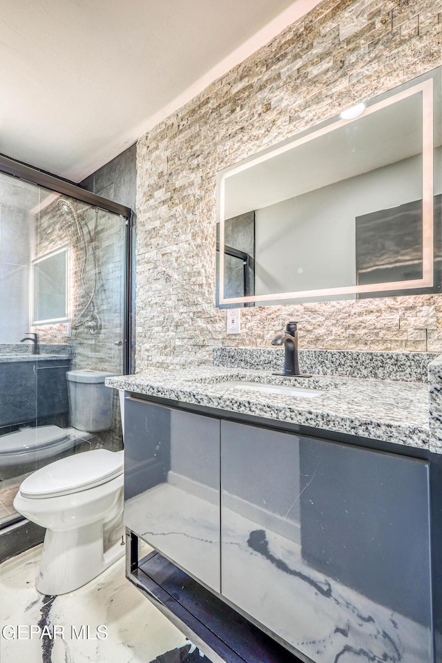 1957 Ratner Cir, El Paso, TX 79936 - bathroom featuring toilet, a shower stall, and vanity