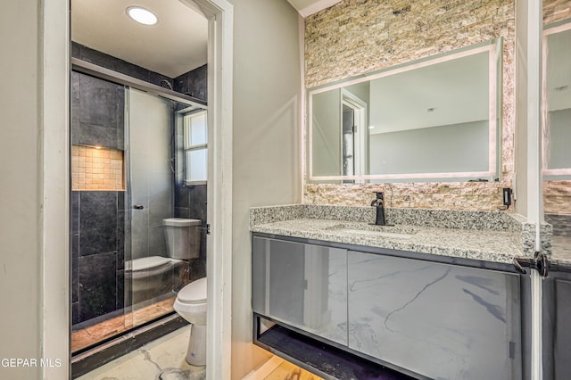 1957 Ratner Cir, El Paso, TX 79936 - full bathroom with toilet, vanity, a stall shower, and marble look tile flooring