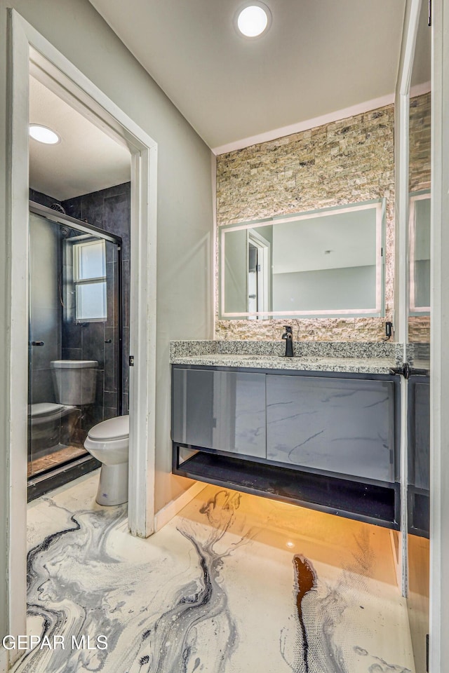 1957 Ratner Cir, El Paso, TX 79936 - bathroom featuring toilet, a stall shower, and vanity
