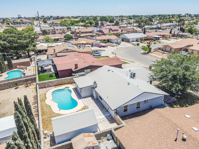 1957 Ratner Cir, El Paso, TX 79936 - aerial perspective of suburban area with a pool area