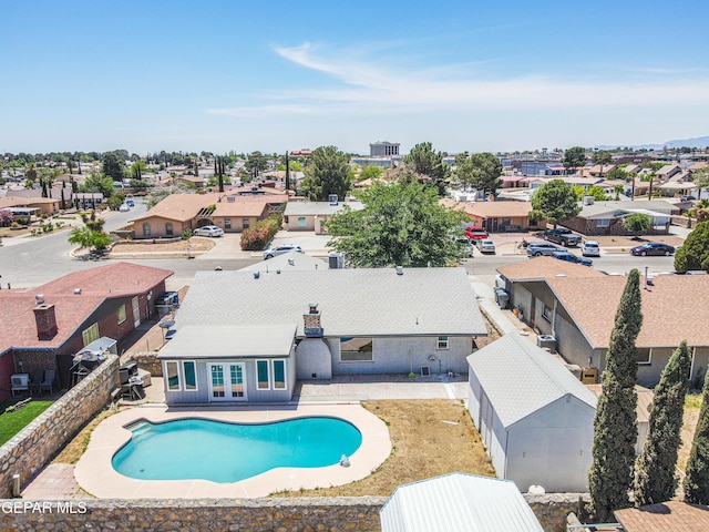 1957 Ratner Cir, El Paso, TX 79936 - view of pool featuring a residential view, french doors, and a fenced backyard