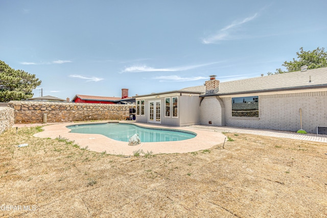 1957 Ratner Cir, El Paso, TX 79936 - view of swimming pool with french doors