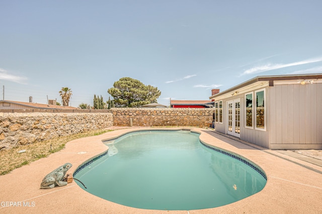 1957 Ratner Cir, El Paso, TX 79936 - view of pool featuring french doors, a patio, and a fenced backyard