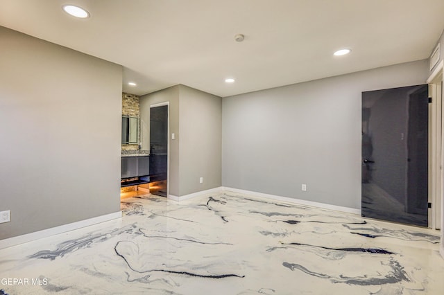 1957 Ratner Cir, El Paso, TX 79936 - unfurnished room featuring marble tiled flooring, recessed lighting, baseboards, and a smoke detector