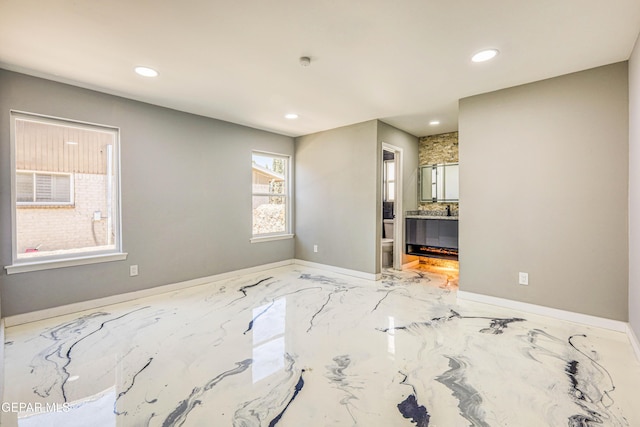 1957 Ratner Cir, El Paso, TX 79936 - unfurnished room featuring recessed lighting, baseboards, and marble finish floors