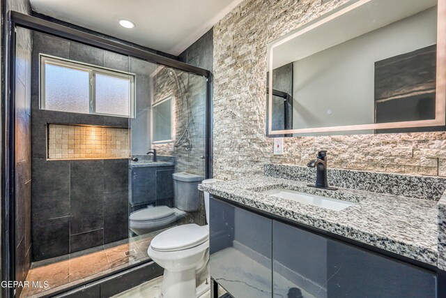 1957 Ratner Cir, El Paso, TX 79936 - full bath with toilet, a shower stall, tile walls, and vanity
