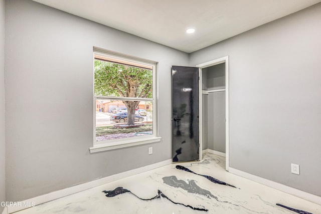 1957 Ratner Cir, El Paso, TX 79936 - unfurnished bedroom with baseboards, marble finish floors, and recessed lighting