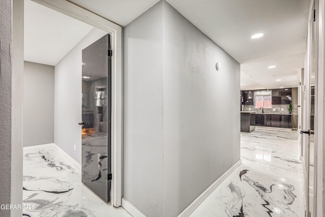 1957 Ratner Cir, El Paso, TX 79936 - hallway with marble tiled floors, baseboards, and recessed lighting
