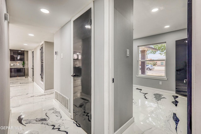 1957 Ratner Cir, El Paso, TX 79936 - corridor with marble tiled flooring, recessed lighting, and baseboards