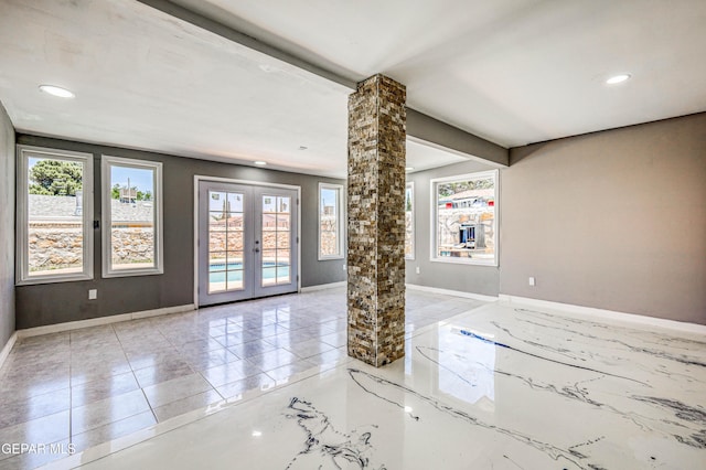 1957 Ratner Cir, El Paso, TX 79936 - spare room with healthy amount of natural light, baseboards, french doors, and recessed lighting