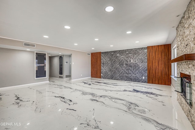 1957 Ratner Cir, El Paso, TX 79936 - unfurnished living room with recessed lighting, a stone fireplace, marble tiled floors, and baseboards