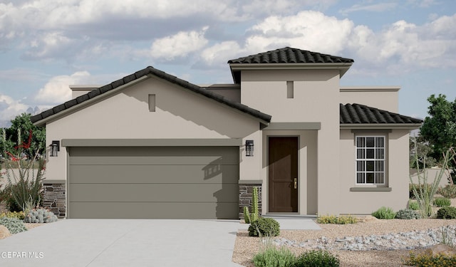 1248 Indigo Sky St, El Paso, TX 79928 - view of front facade featuring an attached garage, a tile roof, driveway, and stucco siding