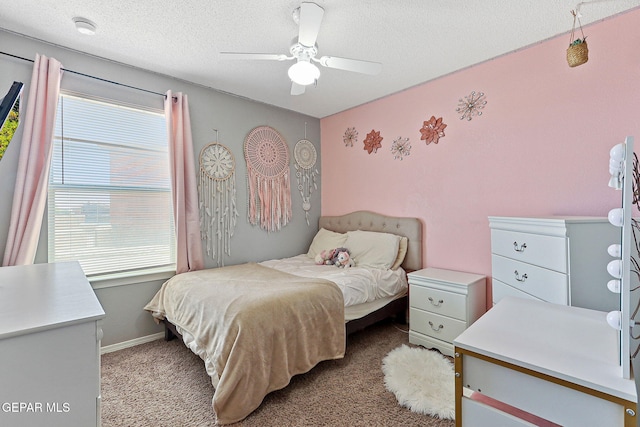 513 Bogota Pl, El Paso, TX 79928 - carpeted bedroom with a textured ceiling and ceiling fan